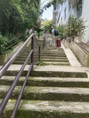 dragging suitcase up a staircases in istanbul.